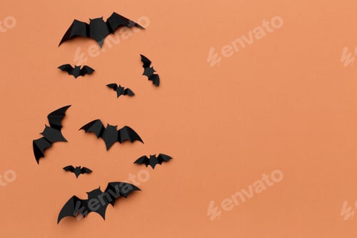 Preview: halloween and decoration concept - paper bats flying