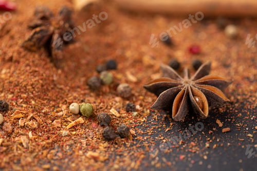 Preview: Close-up of star anise and cinnamon and ground pepper lie on the table. Spicy food concept and