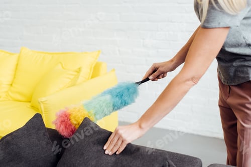 Preview: close up of female hands holding multicolored duster