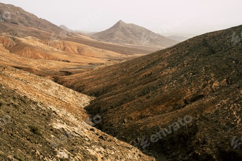Preview: Wild landscape inside fuerteventura island with high desertic mountains from vulcans