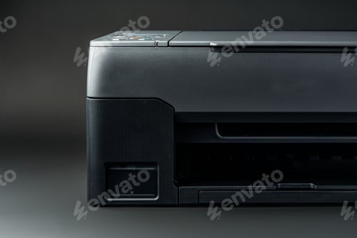Preview: Modern laser printer on black background close up