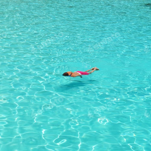 Preview: Man Snorkeling In Crystal Clear Turquoise Water At Tropical Beach
