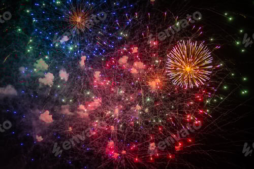 Preview: Festive fireworks in the sky with dark night background and copy space