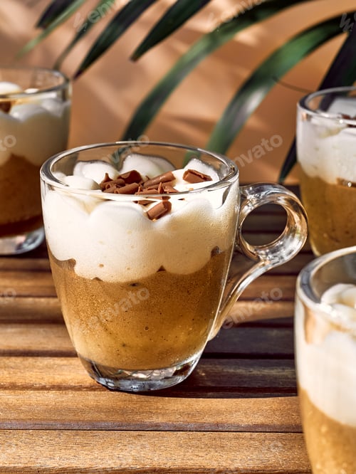 Preview: Traditional Italian dessert Tiramisu in glass cups on wooden table.