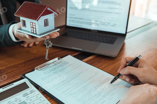Preview: Customer writing signing signature on paper contract with real estate agent with new home concept.