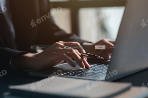 Preview: An individual is typing on a keyboard laptop showing a hologram interface to a member login.