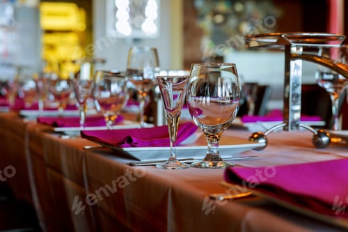 Preview: Room with served tables in restaurant, focus on glass in center