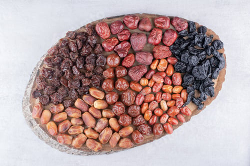 Preview: Set of dried fruits on a wooden platter