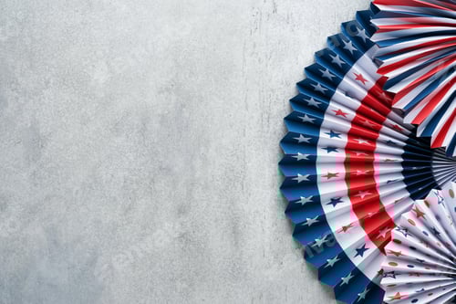 Preview: 4th of July background. USA paper fans, Red, blue, white stars and confetti on gray old concrete wal