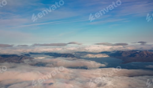 Preview: Aerial view of stunning cloud cover over Svalbards landscape with distant mountains and sea