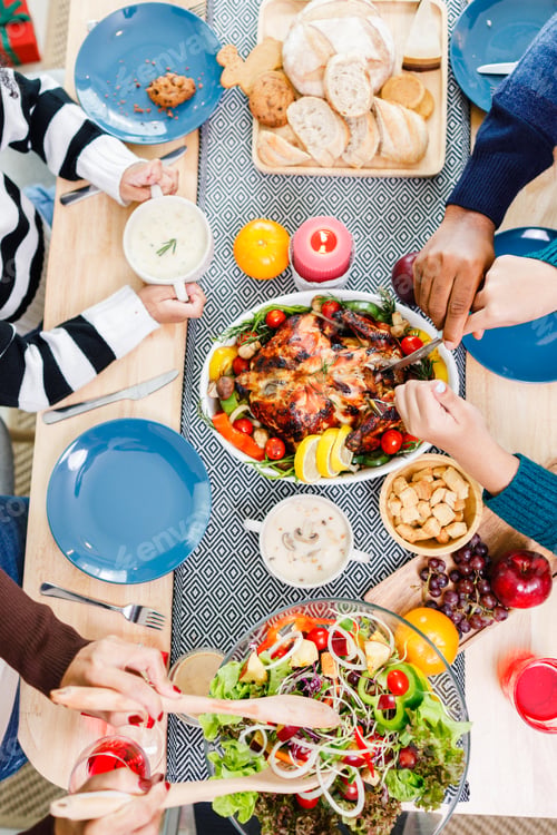 Preview: Top view of Happy family is having dinner at home. Celebration holiday