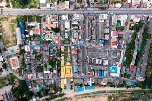 Preview: Crowded commercial building and residential in rural neighborhood and traffic on road