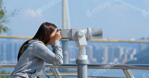 Preview: Tourist look at the binocular for seeing the view in Hong Kong