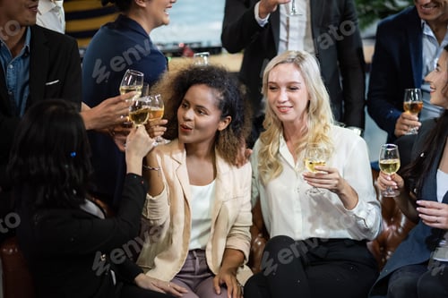 Preview: Toast to success. Group of business people toasting with champagne