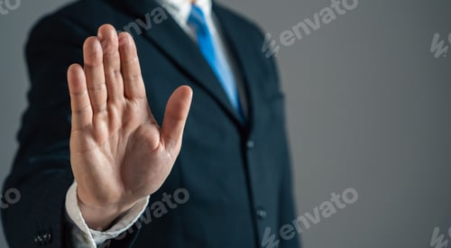 Preview: Businessman shows stop with his hand