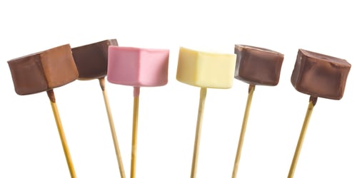 Preview: Colorful chocolate pops on sticks against white backdrop