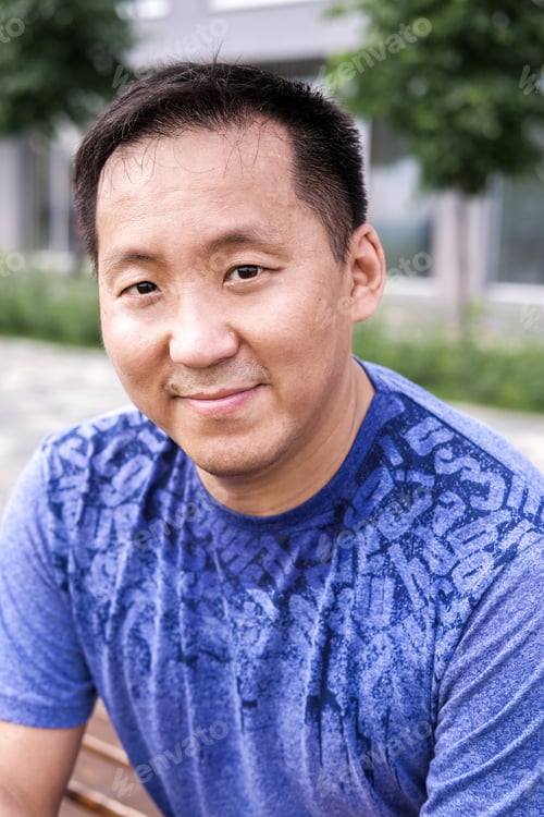 Preview: Korean Man Stretches Against The Background Of The City. Healthy Lifestyle. Adult Man Practicing