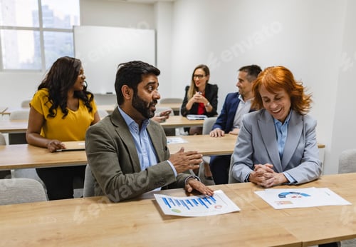 Preview: Multiracial Business Team Engaging in Informal Discussion During Workshop
