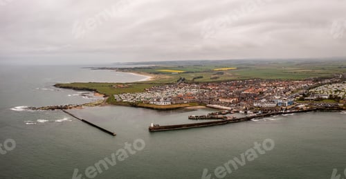 Preview: Aerial landscape view of Seahouses harbour and town in Northumberland