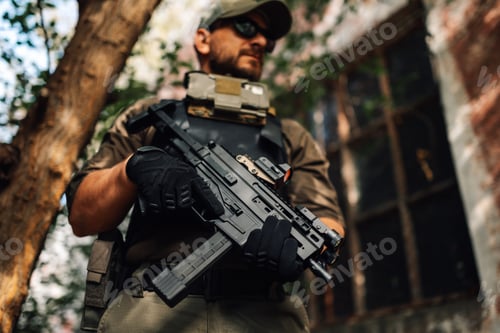 Preview: Soldier holding submachine gun in urban warfare setting