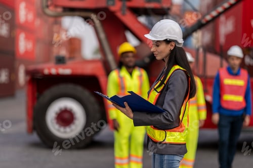 Preview: workers in high visibility safety gear and hard hats discuss operations
