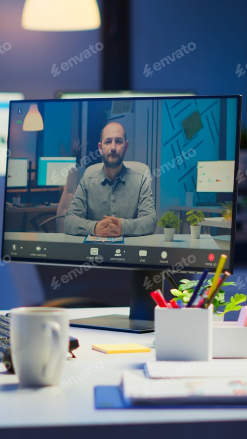 Preview: Woman freelancer discussing with client on video call at midnight
