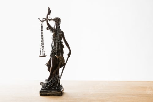 Preview: bronze statuette with scales of justice on wooden surface isolated on white with copy space