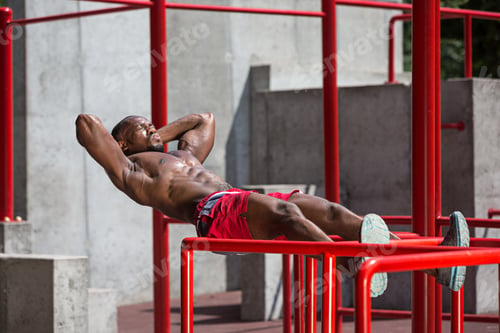 Preview: Athlete doing exercises at stadium