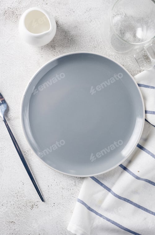 Preview: breakfast table setting iwith empty plate and cup