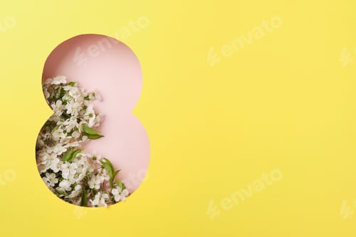 Preview: 8 March greeting card. Paper cut Eight made of yellow background and fresh spring flowers bouquet of