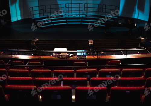 Preview: Rows of red seats in a theatre