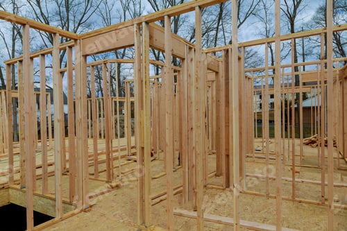 Preview: New residential construction home framing home against a blue sky