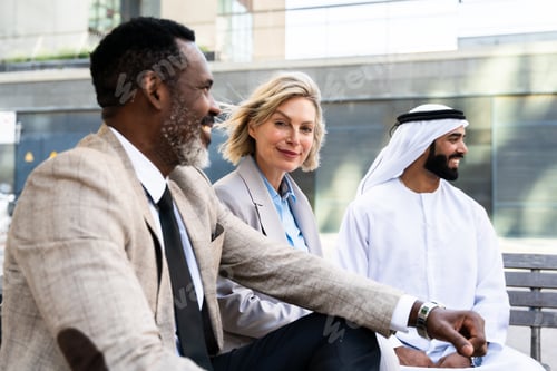Preview: Group of multiethnic business people meeting an emirati businessman