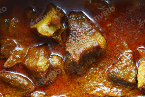 Preview: traditional Indian curry lamb masala in a bowl on table