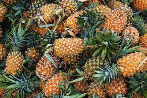 Preview: Background with a heap of ripe pineapples