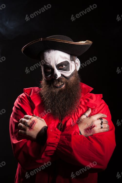Preview: Bearded man in pirate outfit wearing spooky makeup
