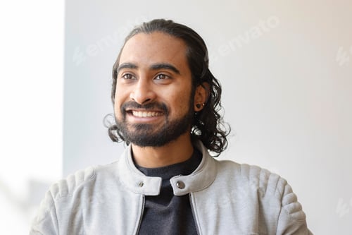 Preview: Smiling creative professional in office