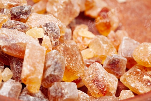 Preview: brown sugar rock organic crystalline close up on dark background