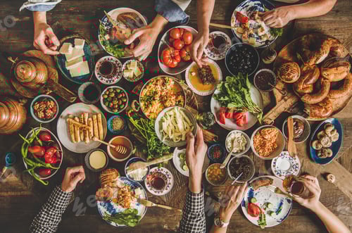 Preview: Traditional Turkish family breakfast table and people taking various food