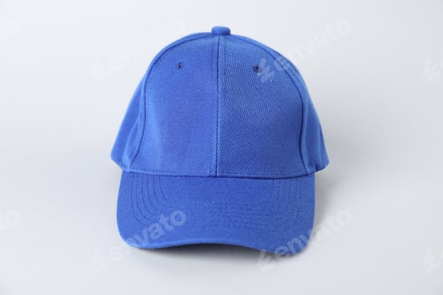Preview: One blue baseball cap on grey background, closeup. Mockup for design