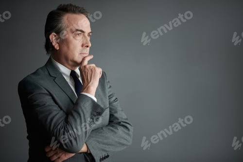 Preview: Pensive Businessman Rubbing Chin