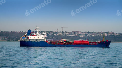 Preview: Big gas tanker or cargo ship in the sea harbour on sunny day