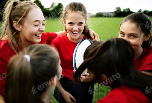 Preview: Cheerful young rugby players on the field