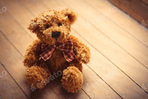 Preview: cute fluffy teddy bear on the wonderful brown wooden background