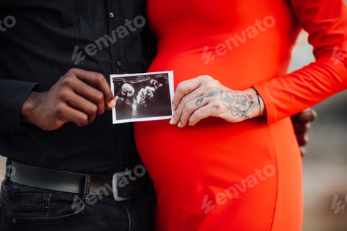 Preview: Young beautiful interracial millennial couple expecting a baby.