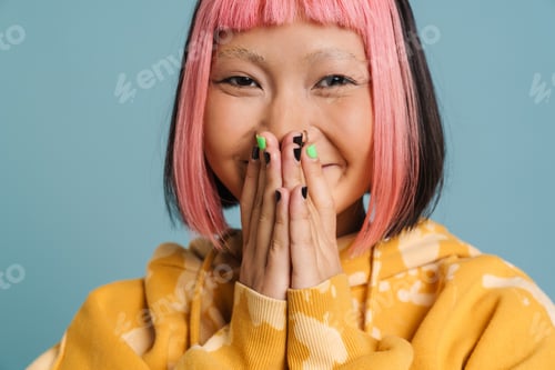 Preview: Asian girl with pink hair laughing and covering her mouth