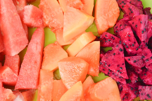 Preview: Top view of watermelons, papayas and dragon fruits. Close up view.