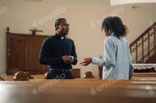 Preview: Priest listening to young woman talking in church