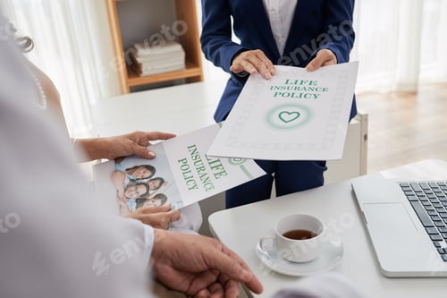 Life Insurance Policy Discussion in a Bright Office