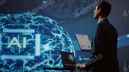 Preview: Startup employee looking over business charts, using AI software